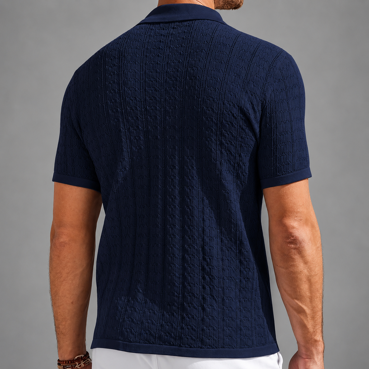 Back fit of navy Ellington textured knit polo